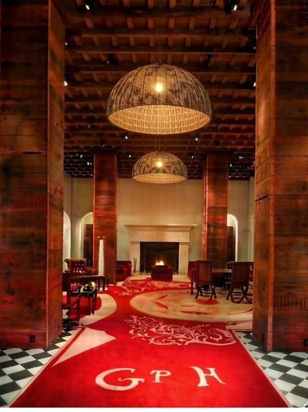 Dome pendants over a red-carpeted hotel corridor