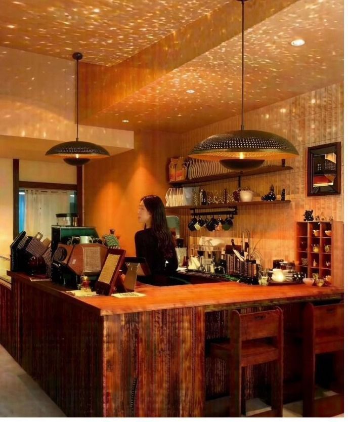 Starlight disc pendants above a coffee bar