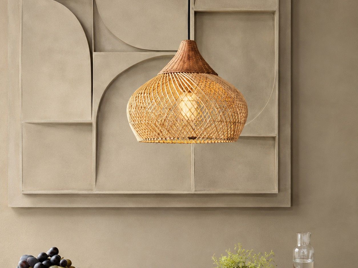 Bamboo Bell pendant glowing against a sculptural stone panel